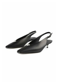 Black slingback shoes with a pointed toe design, smooth leather material, small kitten heel, and a heart-shaped metallic accent detail.
