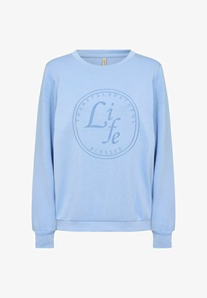 Felpa azzurra realizzata in materiale morbido, con maniche lunghe e scollatura rotonda. Al centro, la scritta grafica recita "Grato, Riconoscente, Benedetto".