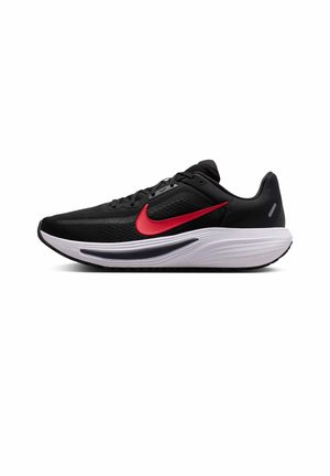 Chaussure de sport noire avec semelle blanche et logo Nike swoosh rouge sur le côté, tige en mesh et fermeture à lacets, vue de côté droit.