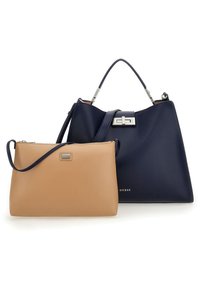 Dwie torebki: duża granatowa torba typu tote z srebrnym zapięciem oraz mała jasnobrązowa saszetka z paskiem, obie wykonane z gładkiej skóry.