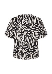T-shirt med kort ärm som har ett svartvitt abstrakt mönster, tillverkad av texturerat tyg. Avslappnad passform med rundad halsringning.