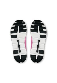 Zapatillas deportivas con una suela blanca y negra, que presentan un patrón de agarre texturizado, y una parte superior rosa asomando por los lados.