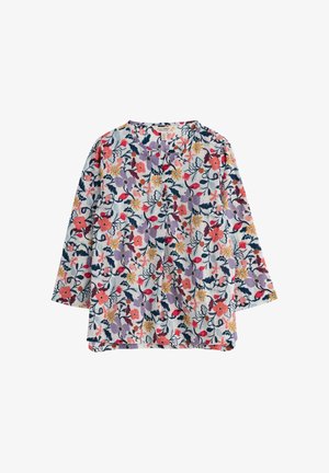 Blouse met lange mouwen, een witte achtergrond en een kleurrijk bloemmotief met rode, paarse, gele en marineblauwe bloemen en bladeren.