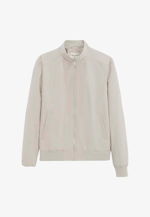 Veste beige clair zippée avec poignets et ourlet côtelés, col montant et poches latérales inclinées.