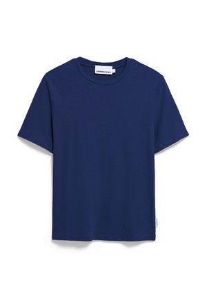 T-shirt bleu marine à manches courtes en tissu doux avec un col rond. Doté d'une petite étiquette de marque sur le côté inférieur gauche.