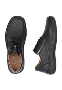 Black leather shoes with textured finish, featuring laces and a side zipper. Cushioned insole and robust rubber outsole.