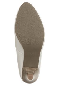 Biała podeszwa buta z teksturowanym wzorem zawierającym różne motywy, w tym torby i wieżę Eiffla, o zwężającym się kształcie.