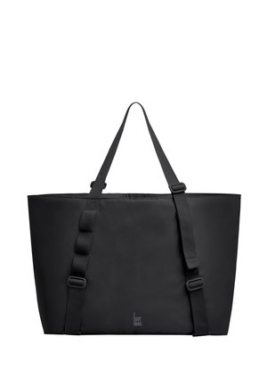 Borsa tote rettangolare nera con due spallacci regolabili e logo "GOT BAG." centrato vicino al fondo.