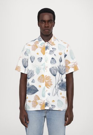 Short-sleeve button-up shirt in white with a floral pattern in blue, yellow, and green. Features a collar and front button closure.