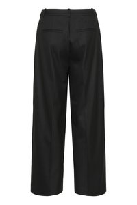 Mustad laiade sääreosadega püksid, valmistatud siledast kangast. Omavad lamedat vöökohaga vöörihma, kahte tagataskut ja istuvat lõiget. Lihtne ja minimalistlik disain.