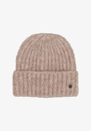 Pehmeast, ribatud kudumist beežist beebist, millel on volditud äär ja väike ümmargune metallist logo silt äärte küljes.