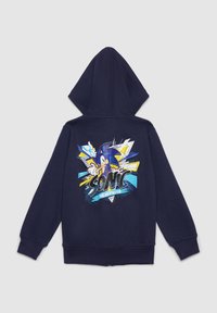 Felpa con cappuccio blu navy con una grafica colorata di Sonic the Hedgehog sul retro, con cappuccio regolabile con coulisse e polsini a coste.