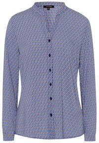 Chemise à motifs bleu et blanc avec des manches longues, un col mandarin et une fermeture à boutons sur le devant, ornée de boutons sombres et d'un design géométrique.