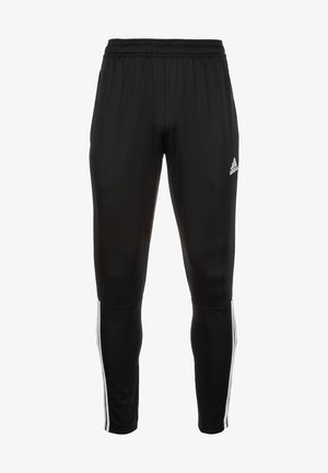 Pantalon de survêtement Adidas noir avec bandes blanches latérales et taille élastique, coupe ajustée, tissu en polyester.