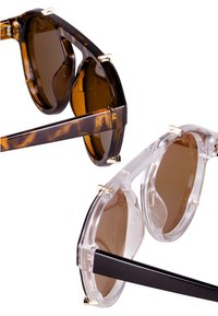 Brown tortoiseshell and clear sunglasses with circular lenses, gold hardware accents, and sleek rectangular temples.