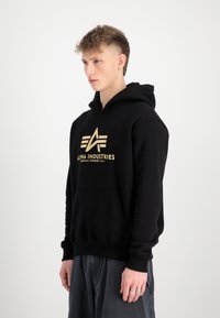 Alpha Industries Jersey con capucha - black gold