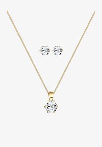 Geselecteerd, gold-coloured