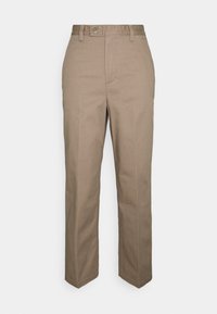 Beiga bomullbyxor med rak skärning, knappstängning och bältesögglor. Har framvikningar och minimala sömnadsdetaljer.