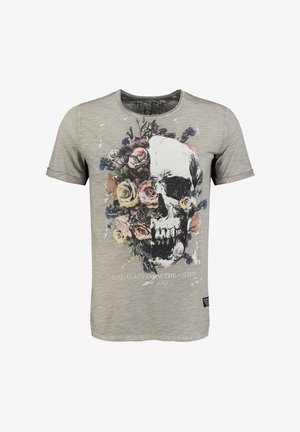 Grijze t-shirt met korte mouwen, voorzien van een grote schedelafbeelding omringd door bloemen. De tekst luidt "STA OP UIT DE AS!" in het wit.