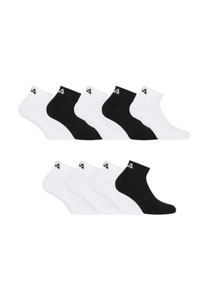 Dix chaussettes montantes disposées en deux rangées, alternant les couleurs noire et blanche, chacune avec un petit logo près du bord-côte.