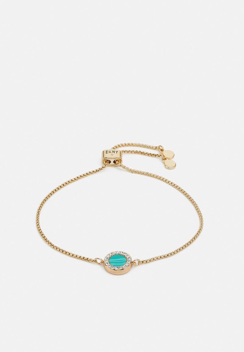 Auksinės grandinėlės apyrankė su ovaliu turquoise akmeniu, supakuotu aplinkiniame ratlankio kristalų akcento. Reguliuojamo dydžio su užsegimu.