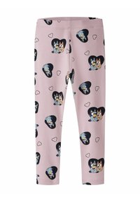 Leggings van lichtroze stof met een patroon van cartoonfiguren binnen zwarte harten, afgewisseld met kleinere harten. Rekbare stof.