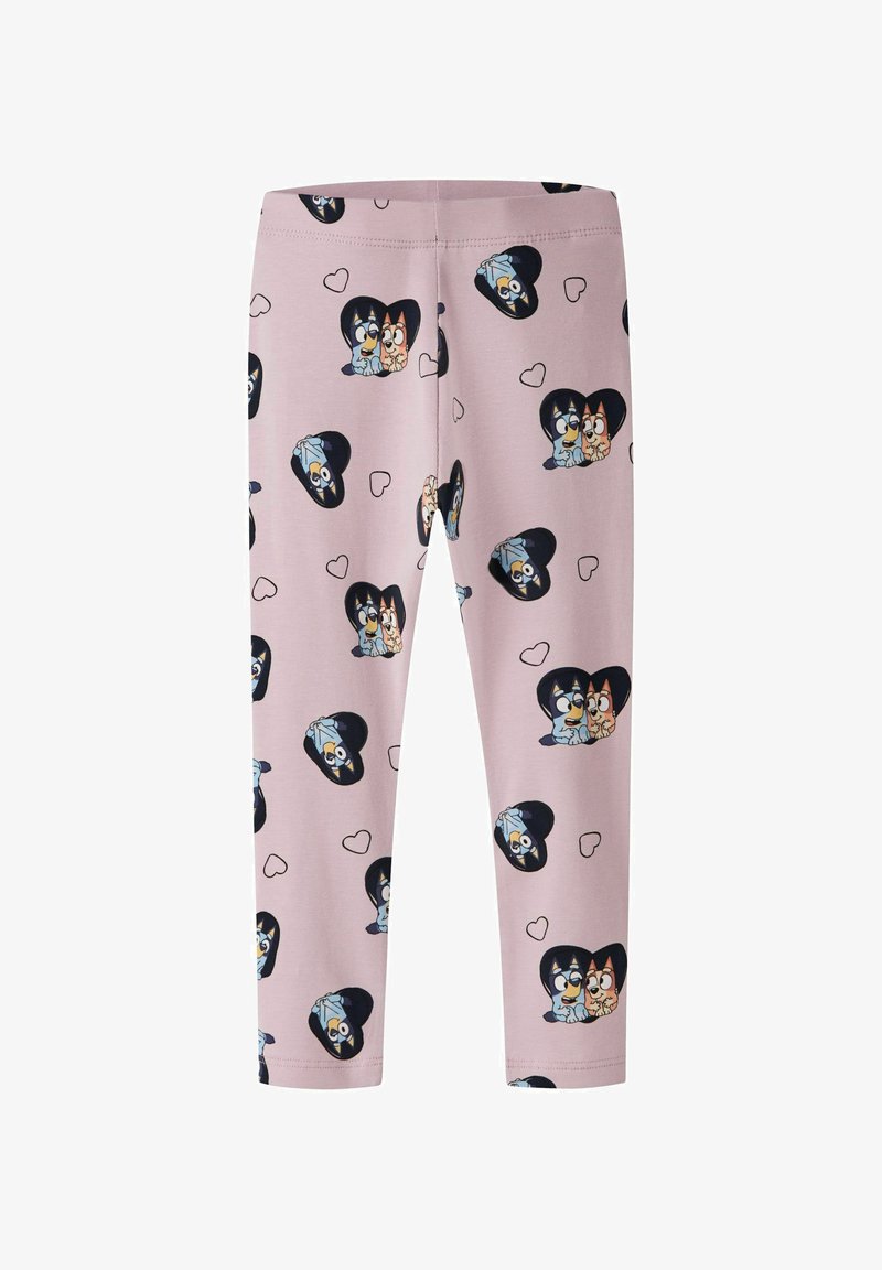 Leggings van lichtroze stof met een patroon van cartoonfiguren binnen zwarte harten, afgewisseld met kleinere harten. Rekbare stof.