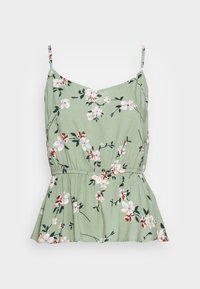 Top floral verde com alças finas ajustáveis, apresentando uma cintura franzida e barra peplum. O padrão floral inclui flores brancas e borgonha.