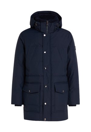Parka bleu marine rembourrée avec une capuche en fourrure, boutons-pression, deux grandes poches avant et fermeture à zip. Présente une texture extérieure lisse.