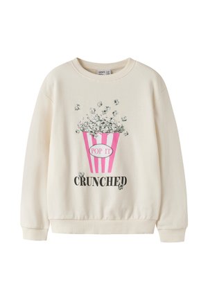 Cremefarbener Sweatshirt mit einer pink gestreiften Popcorneimer-Grafik und den Worten "POP IT" und "CRUNCHED" darunter.