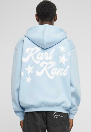 Light blue hoodie with white "Karl Kani" text and star graphics on the back; features a drawstring hood and ribbed cuffs.