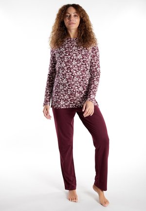 Langärmliges Oberteil mit burgunderrotem Blumenmuster und passenden burgunderroten Hosen. Hergestellt aus weichem Stoff mit lässiger Passform und minimalen Details.