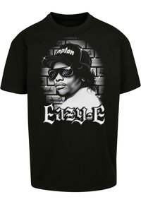Zwarte katoenen T-shirt met een grafische print van een persoon met een zonnebril, met de tekst "Eazy-E" en een graffiti-achtige achtergrond.