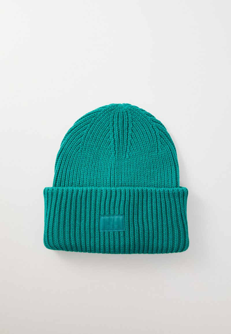 Teal knitted beanie with ribbed texture, featuring a folded cuff and a rectangular logo patch on the front.