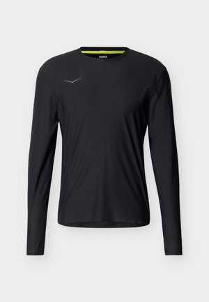 Μαύρο αθλητικό μακρυμάνικο μπλουζάκι με στρογγυλή λαιμόκοψη και μικρό ανακλαστικό λογότυπο στο αριστερό στήθος, σχεδιασμένο για επιδόσεις.