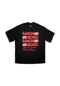 Black cotton t-shirt featuring bold red text: “RAMONES LIVE” repeated, with event details at the bottom in smaller font. Short sleeves.