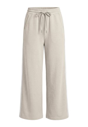 Beige wijde joggingsbroek met elastische tailleband, trekkoord, zijzakken en subtiele zijstrepen, weergegeven op een witte achtergrond.