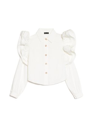 Blouse blanche à manches longues avec manches bouffantes, col classique, fermeture à boutons sur le devant et discrètes décorations florales sur les boutons. Tissu à texture lisse.