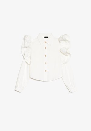 Blouse blanche à manches longues avec manches bouffantes, col classique, fermeture à boutons sur le devant et discrètes décorations florales sur les boutons. Tissu à texture lisse.