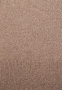 Brauner Strickstoff mit einer feinen, weichen Webart und einem subtilen Stretch. Einheitliche Farbe mit einer glatten, sanften Oberfläche.