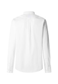 Chemise blanche à manches longues avec poignets boutonnés et pliée au dos, vue de dos sur un fond blanc.