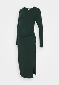 Gravidklänning i mörkgrön, långa ärmar, rund halsringning, rynkade sid sömmar, sprund i fållen, tillverkad av mjukt, stretchigt material.