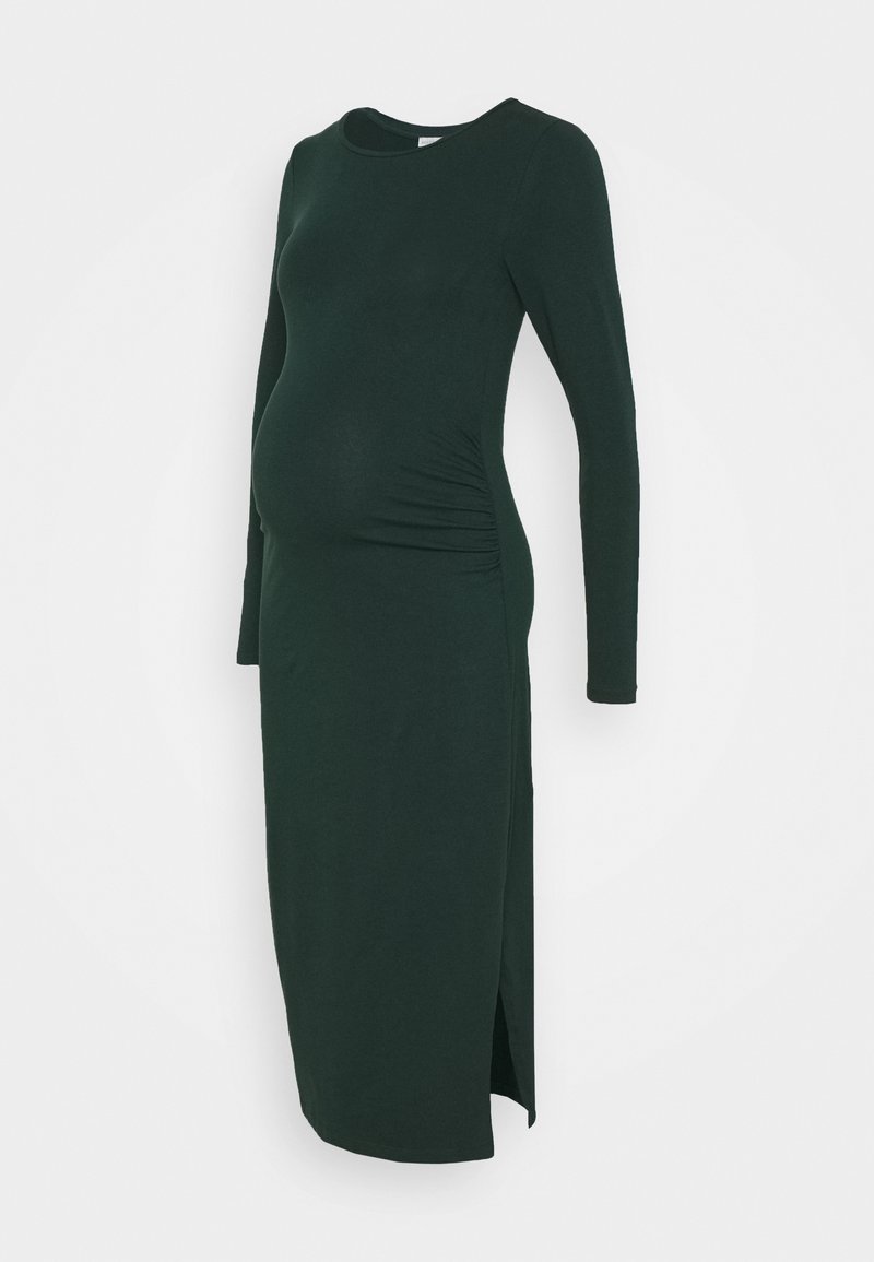 Gravidklänning i mörkgrön, långa ärmar, rund halsringning, rynkade sid sömmar, sprund i fållen, tillverkad av mjukt, stretchigt material.