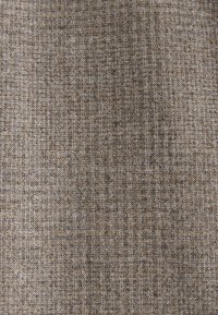 Textured fabric in shades of brown and gray, featuring a woven pattern with subtle variations in color and texture throughout.