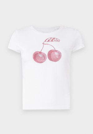 Hvit kortermet t-skjorte med rosa paljettkirsebær og "Guess" tekst over dem. Klassisk rund hals-design med myk tekstur.