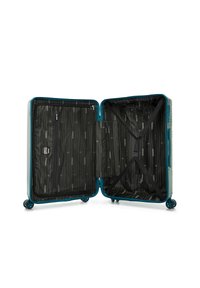 Valigia rigida con esterno di colore teal, interno con fodera a righe nere, tasca con zip e cinghie incrociate regolabili per fissare gli oggetti.