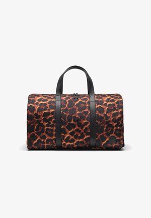 Duffle bag with a black and brown leopard print fabric, featuring black leather straps and a zip closure. Accented with a logo patch.