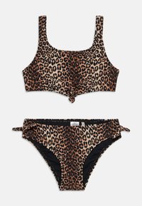 Leoparda raksta bikini komplekts ar kvadrātveida kakla izgriezumu, priekšpuses mezglu un regulējamiem sānu saitēm. Izgatavots no mīksta, elastīga auduma.