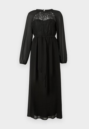 Vestido maxi negro de manga larga con corsé de encaje, mangas transparentes y cinturón atado en la cintura sobre un fondo liso.