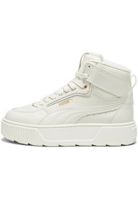 Beżowe sneakersy Puma typu high-top wykonane z gładkiej skóry z puszystą wyściółką wewnętrzną, z tonowanymi sznurówkami, grubą białą podeszwą i akcentami z logo.